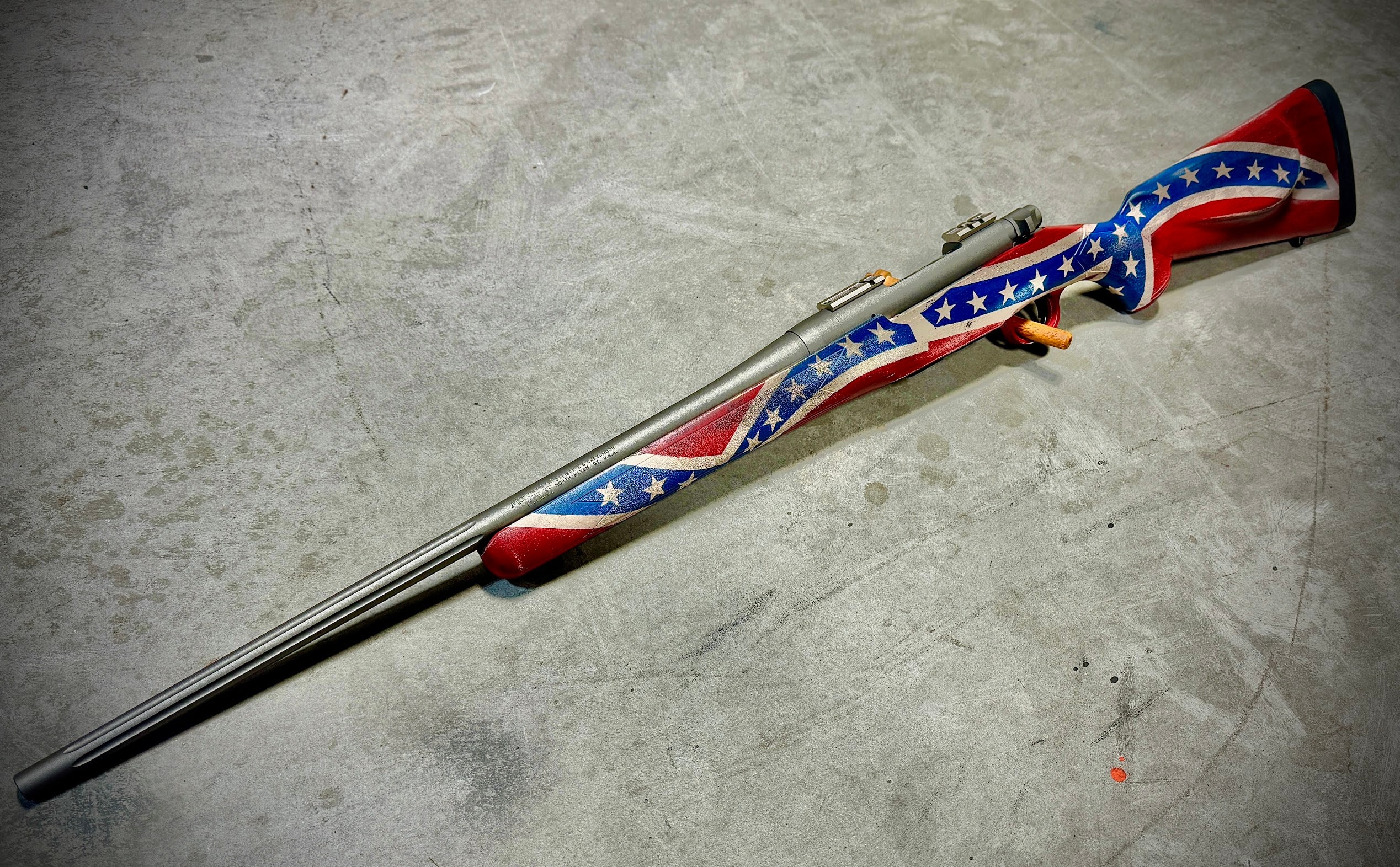Custom flag pattern Cerakote bolt-action rifle — red, white, blue, and silver finish on stock and action by Northwoods Firearms