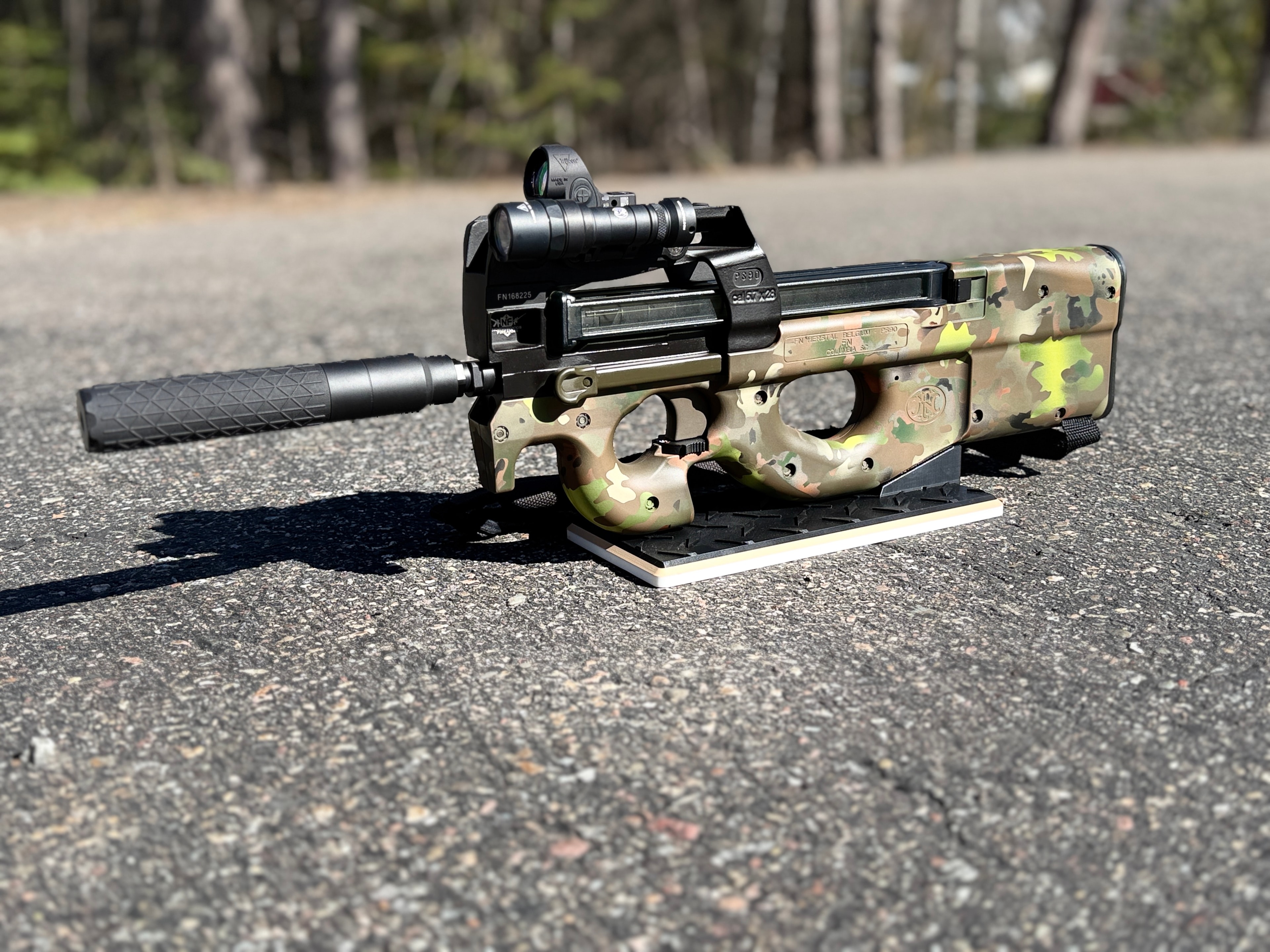 FN P90 with MultiCam Cerakote finish, suppressor, and Vortex red dot — custom build by Northwoods Firearms, Crandon, WI
