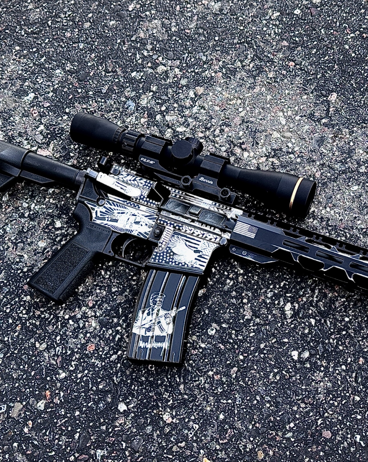 Full-coverage laser-engraved AR-15 with patriotic American eagle, Statue of Liberty, US flag, and soldier scenes on upper and lower receiver — Burris scope — by Northwoods Firearms
