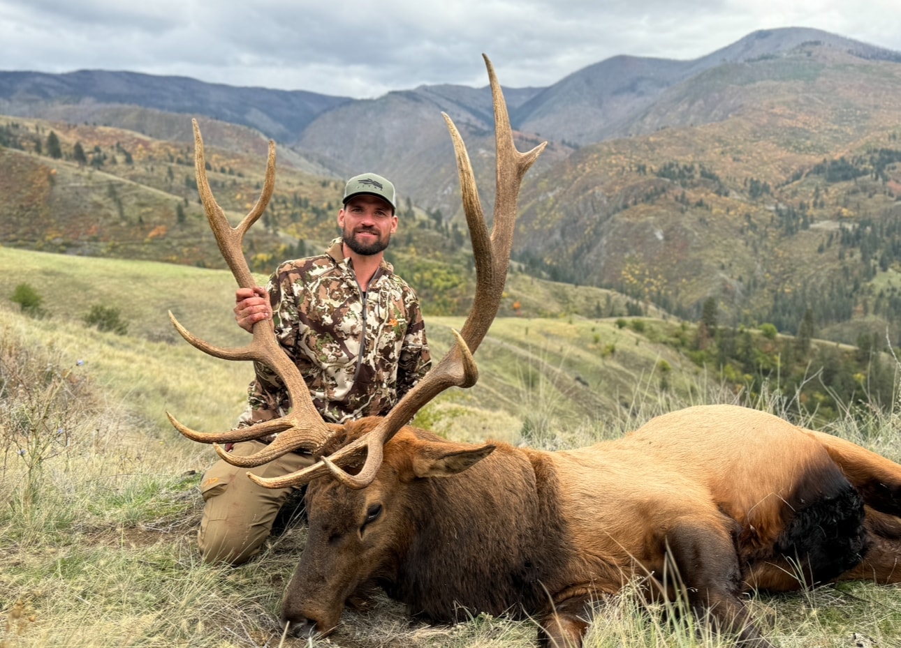 Bobby Connor with trophy bull elk in mountain canyon country
