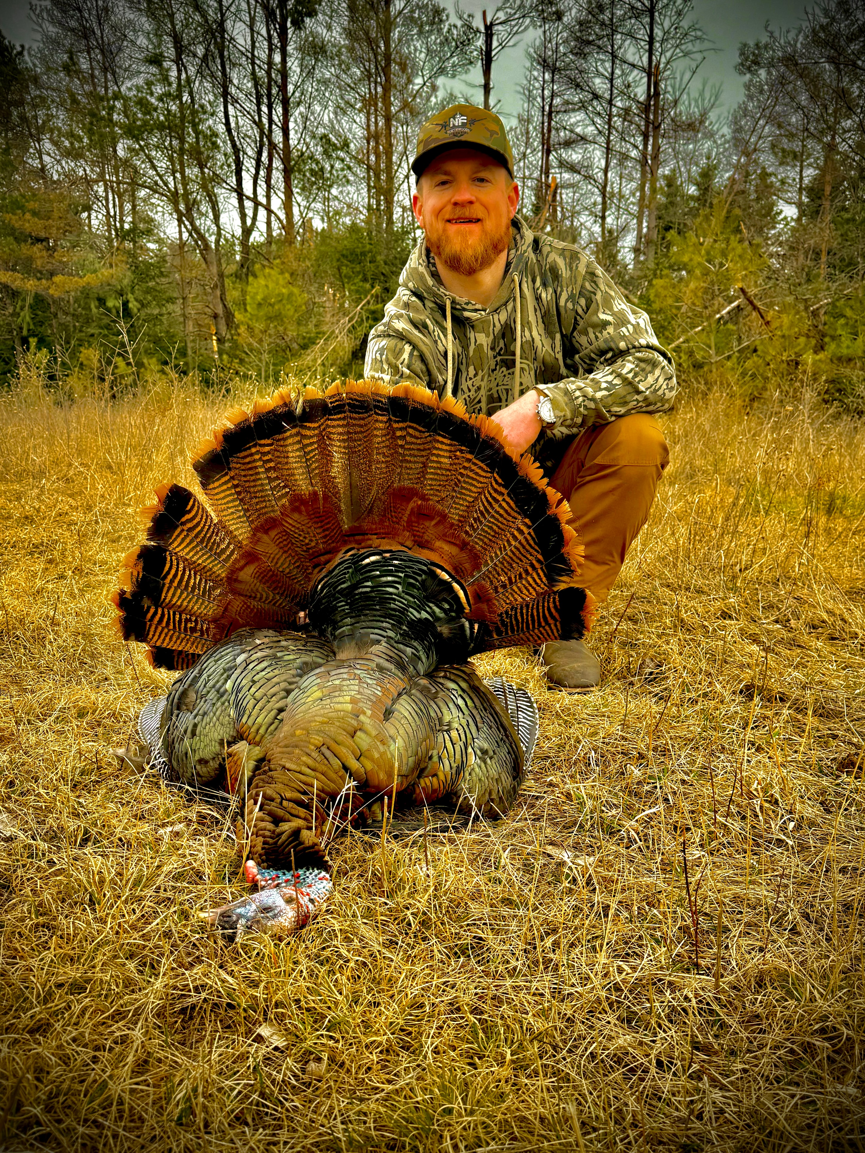Bobby Connor with trophy tom turkey in Wisconsin woods